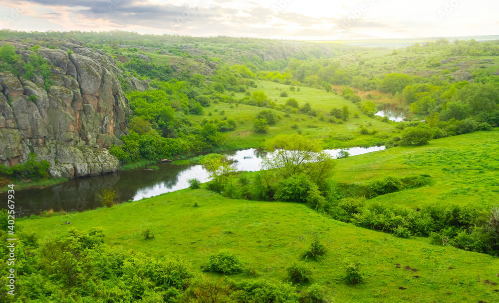 green mountain canyon with small riverat the sunrise