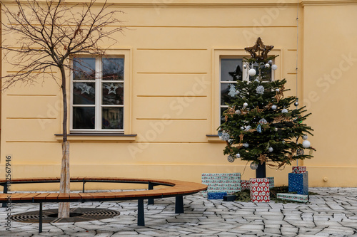 Christmas tree near Cultural house Rip at Hus Square town square in winter day, Roudnice nad Labem, Central Bohemia, Czech Republic © AnnaRudnitskaya