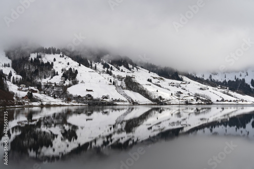 Beautiful winter landscapes along the shores of the Wagital lake in the idyllic pre-alps region of the Schwyz canton, Central Switzerland photo