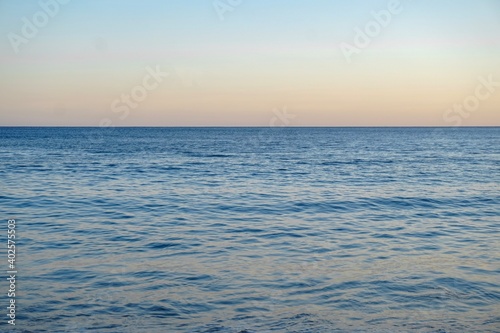 The beautiful colourful Atlantic Ocean at sunset on the South Coast of Cornwall