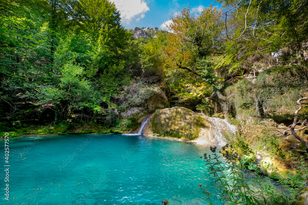waterfall in the forest, Urederra river. Navarra, Spain waterfall in the forest, Urederra river. Navarra, Spain