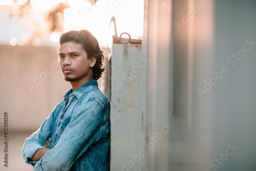 Photography Handsome long hair young man portrait at outdoor in evening light