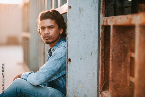 Photography Handsome long hair young man portrait at outdoor in evening light
