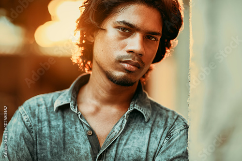Photography Handsome long hair young man portrait at outdoor in evening light
