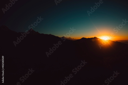 Himalayan mountain peak Annapurna Range silhouette with sunrise.