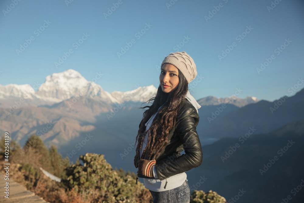 Beautiful young women posing over Himalaya background.