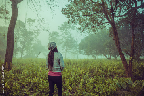 Young women looking at the Forrest. Adventure trip © krishna
