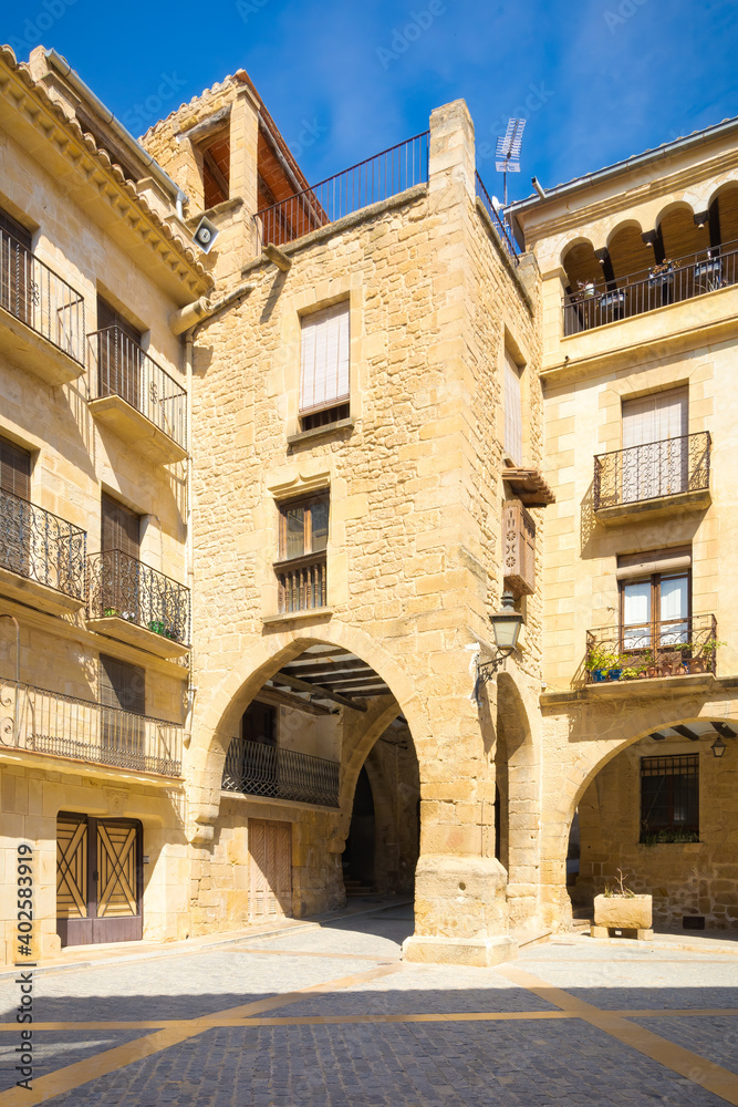 Entrance to the arcaded square of the historic center of Calaceite, Teruel, Spain