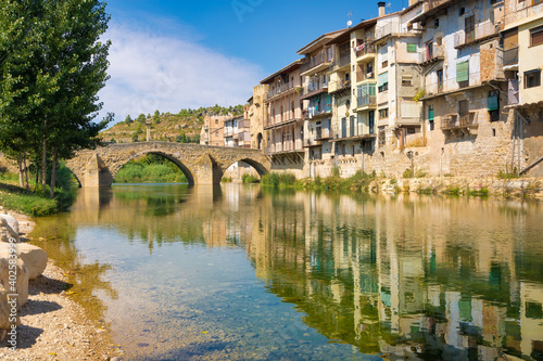 View from Rio Matarranya the medieval bridge that gives access to the historic center of Valderrobres, Aragon, Spain