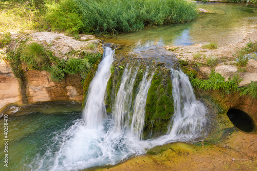 View of one of the waterfalls of the Matarranya river as it passes through the town of Beceite  Aragon  Spain