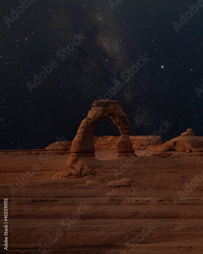 beautiful delicate arch with milky way in the background