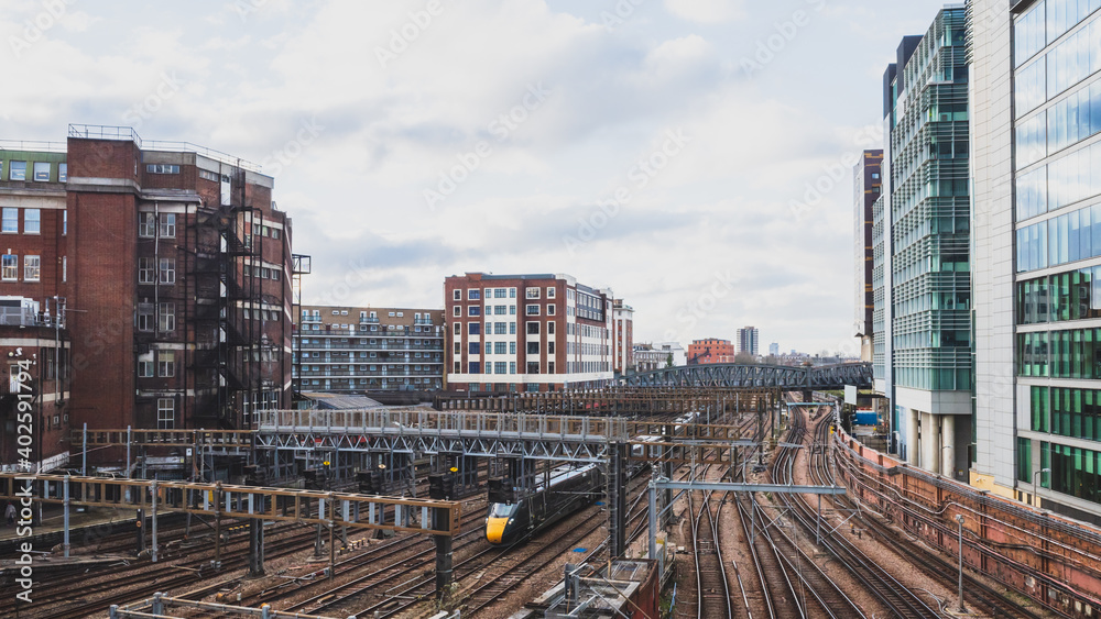 Train tracks near Paddington train station and buildings in London, UK