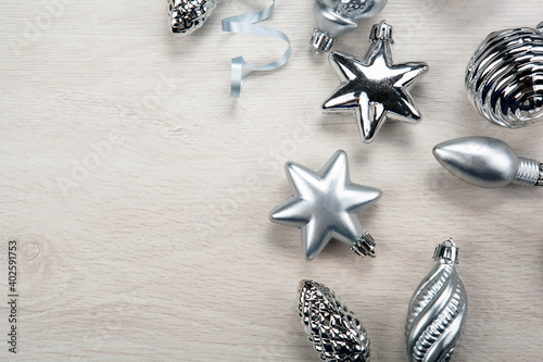 silver christmas glass toys on gray background
