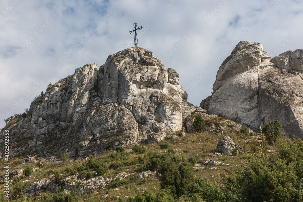 Fototapeta premium The cross on the background of clear sky at the top Biaklo (or Maly Giewont) near Olsztyn near Czestochowa