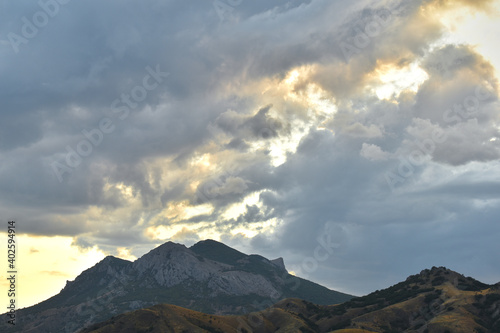 clouds over the mountain tops at sunset
