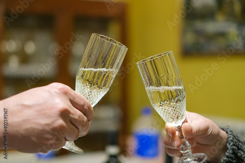 People toasting sparkling white wine glasses for good wishes event,happy drinking friend