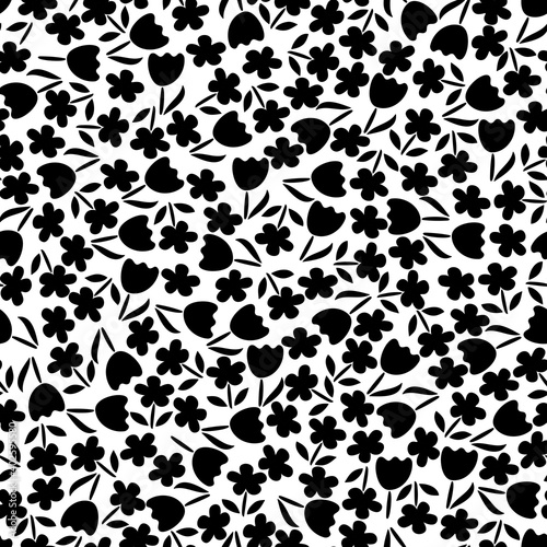 Trendy black and white vector texture. Monochrome floral seamless pattern. Fashion, fabric, ditsy print, wallpaper. Hand drawn silhouette flowers and leaves scattered random on white backgroud