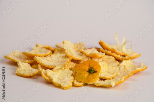 Orange tangerine shells, slices close-up isolated on white background