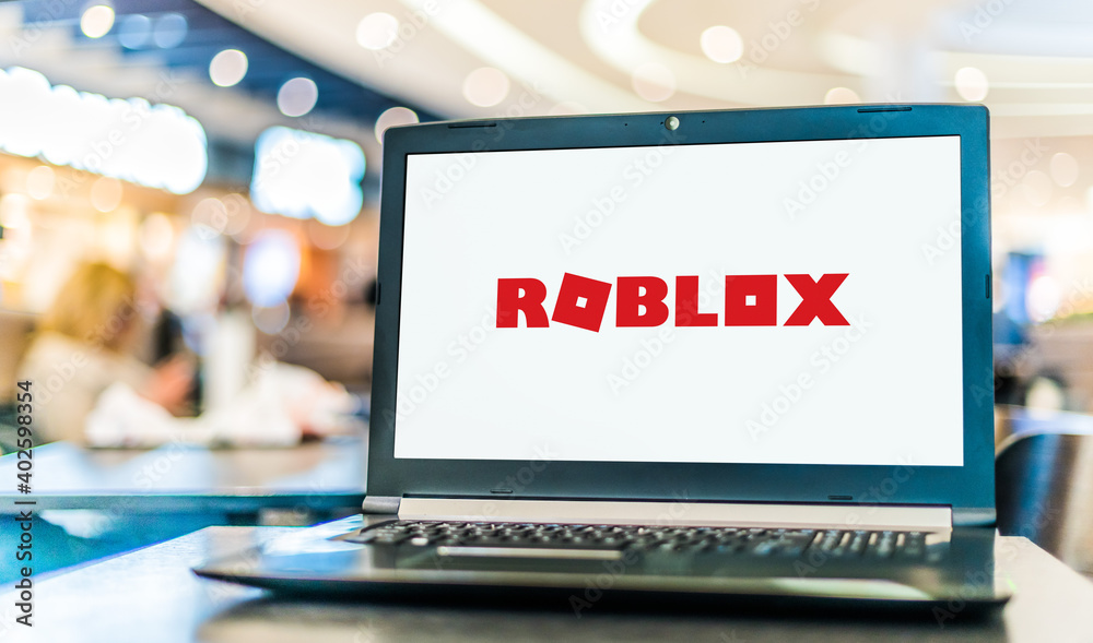 Laptop computer displaying logo of Roblox Stock Photo Adobe Stock