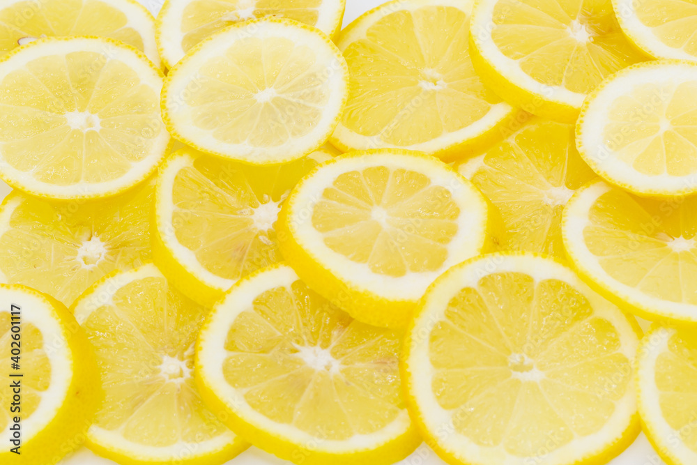Some vitamin rich lemons cut and placed side by side as a background Some vitamin rich lemons cut and placed side by side as a background