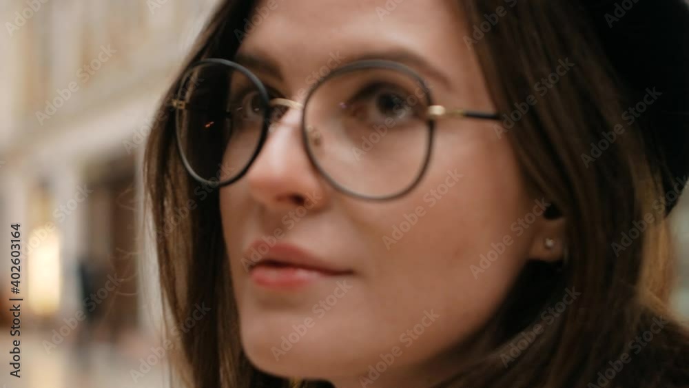 young beautiful woman writer walks around the city with a notebook in her hands, close up woman portrait young beautiful woman writer walks around the city with a notebook in her hands, close up woman portrait