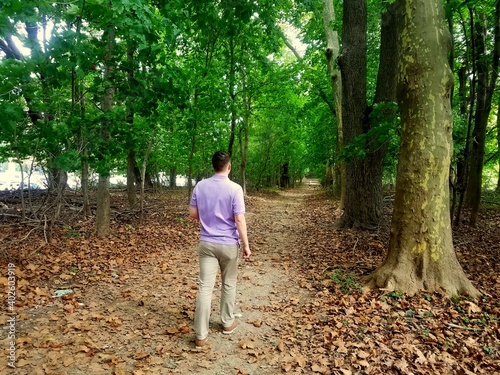 A young guy walking on the hiking trail at Bellevue State Park, Wilmington, Delaware, U.S © K.A