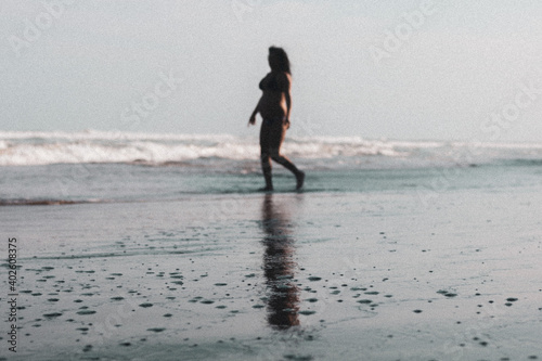 person walking on the beach