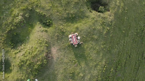 Aerial view of people eating outside. photo