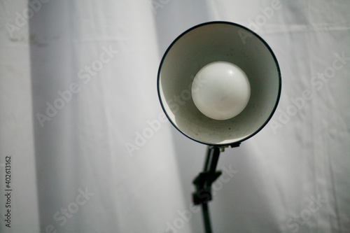 closee up of desk lamp isolated on white fabric