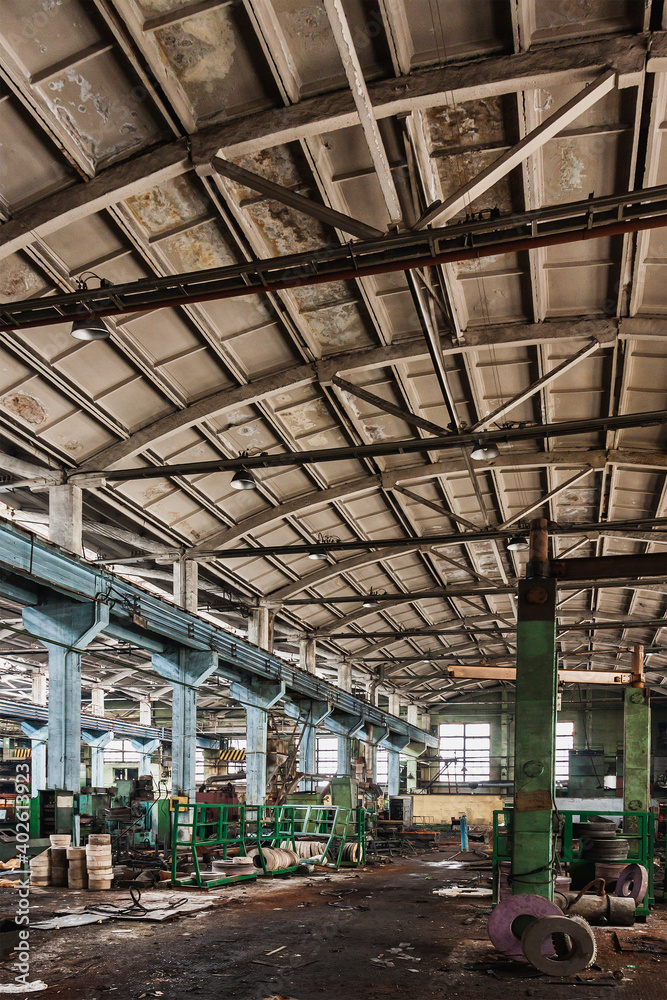 An abandoned old large industrial hall is waiting to be demolished. Former Khabarovsk plant for the production of diesel engines.