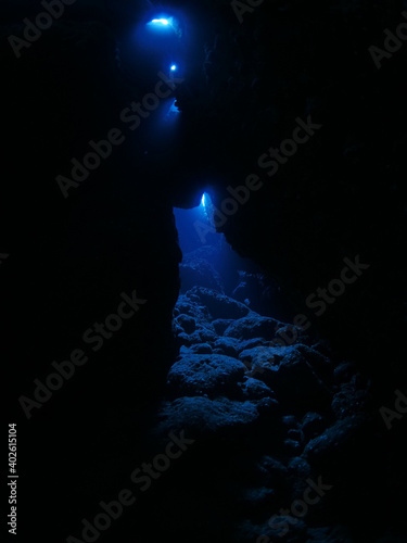 scuba divers exploring caves underwater cave diving