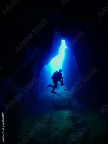 scuba divers exploring caves underwater cave diving