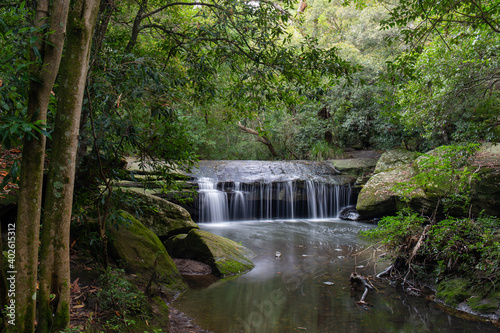 A small waterfall under the tree at Terry's Creek, Sydney, Australia.