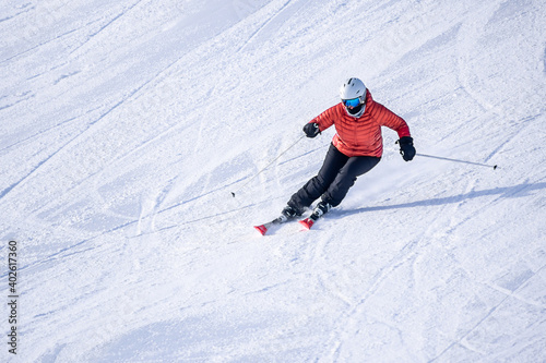 People are having fun in downhill skiing and snowboarding 