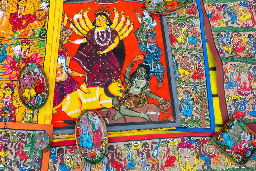 Colorful Pattachitra or Patachitra - traditional, cloth-based scroll painting of Hindu Goddess Durga killing demon Asura. For sale at Handicrafts fair.