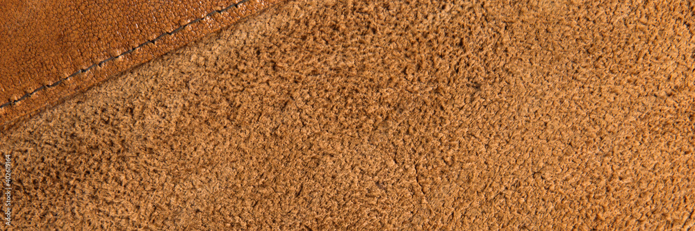leather grunge background: an old piece of tough camel skin, with scuffs, spots, scars, stitched seams. leather grunge background: an old piece of tough camel skin, with scuffs, spots, scars, stitched seams.