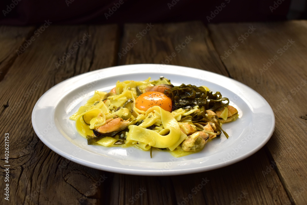 Papardelle pasta with mussels, sea grass and yolk