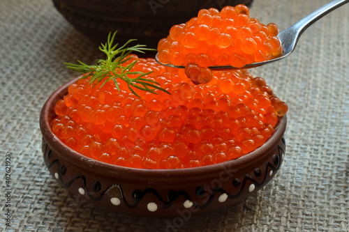 red caviar of river trout on a spoon
