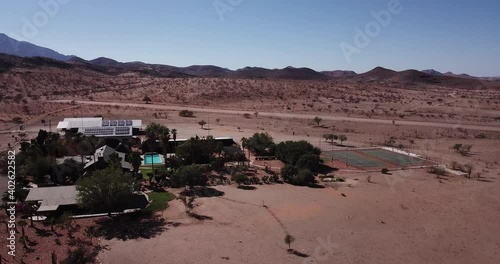 4K aerial drone footage of Rooisand Ranch, a luxury lodge with swimming pool near Gamsberg Pass and Namib-Naukluft Park in Namibia, southern Africa photo