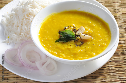 yellow daal or toor daal with tadka on top and white rice is every Indian food