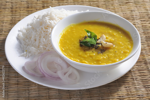 yellow daal or toor daal with tadka on top and white rice is every Indian food