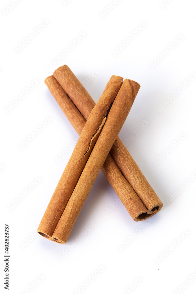 Heap of cinnamon sticks on white Heap of cinnamon sticks on white