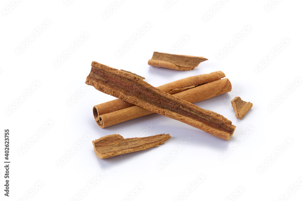 A heap of cinnamon sticks on white background A heap of cinnamon sticks on white background