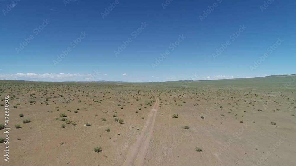 Aerial view of road in Mongolia's Gobi Desert. Govi-Altay, Mongolia. Aerial View Aerial view of road in Mongolia's Gobi Desert. Govi-Altay, Mongolia. Aerial View