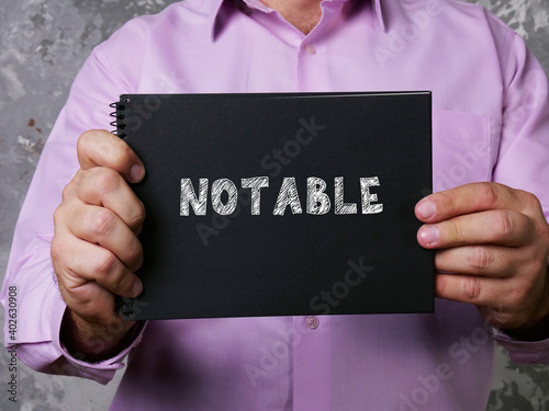Business concept about NOTABLE with inscription on the sheet.