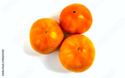 Stock Foto Closeup of yellow orange tomato isolated on white background
