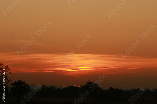 Orange light of sunrise  silhouette and blue sky in the morning 