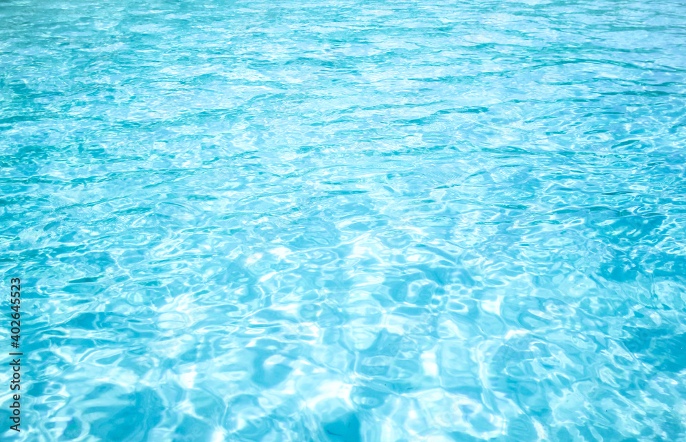 Ripple blue water in the pool background 