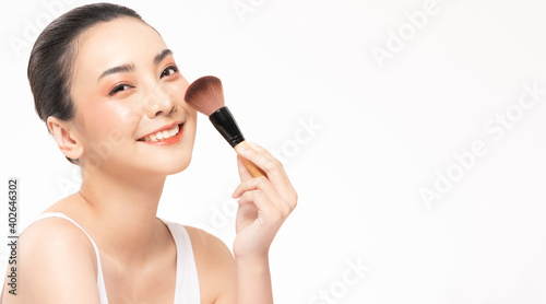 Beauty asian woman hold make up brush and cheerful with make up brush