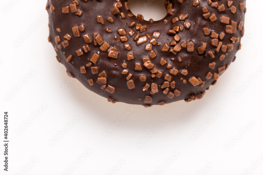 Chocolate donut on a white background close-up. Chocolate donut on a white background close-up.